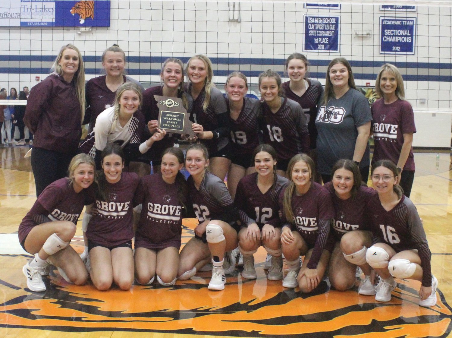 Mountain Grove’s volleyball team celebrates after winning the Class 3, District 11 title when they defeated Forsyth at Hollister High School.